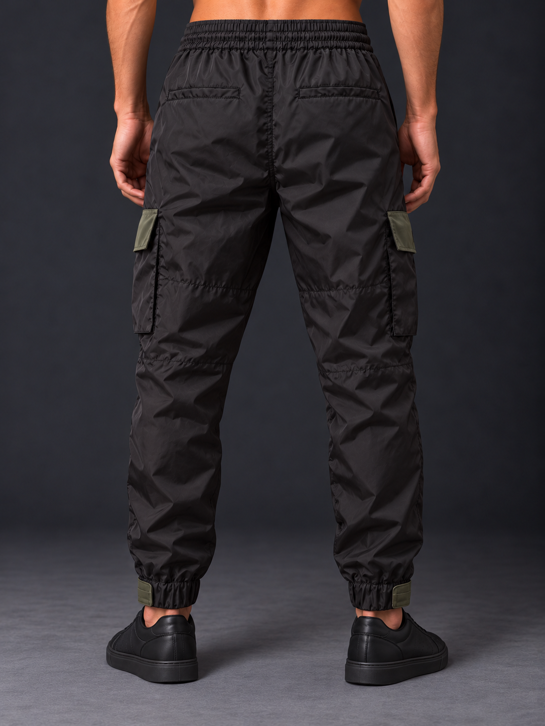 Rear studio view of black cargo trousers